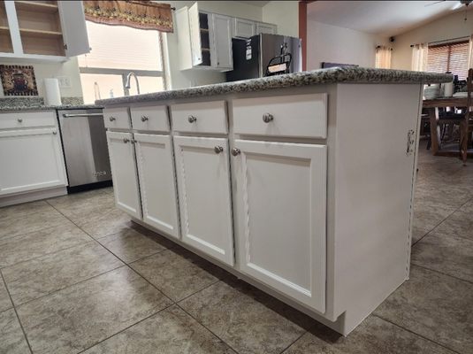 Cabinet Painting. - We repainted these kitchen cabinets and brought new life to an old Kitchen. You can repaint your cabinets at a fraction of the price that it cost to replace them!