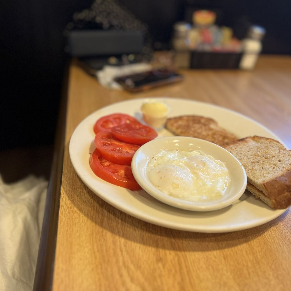 Poached eggs tomatoes and toast