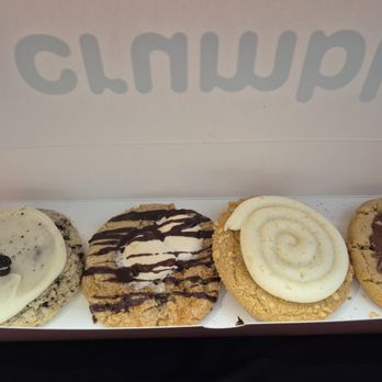 Crumbl - Green Valley - Cookies from this week of Crumbl cookie flavors. Left to right: Cookies n cream milkshake, s'mores, vanilla crumb cake, and kitkat wafer. - Bakeries Near Me - Henderson, Nevada Crumbl - Green Valley - Cookies from this week of Crumbl cookie flavors. Left to right: Cookies n cream milkshake, s'mores, vanilla crumb cake, and kitkat wafer. - Bakeries Near Me - Henderson, Nevada