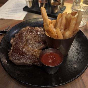 Bourbon Steak by Michael Mina - Secret steak frites which is a 12oz black angus ribeye - Steakhouses Near Me - Las Vegas, Nevada Bourbon Steak by Michael Mina - Secret steak frites which is a 12oz black angus ribeye - Steakhouses Near Me - Las Vegas, Nevada