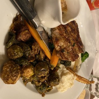 Hamrock's Restaurant - Grilled Pork Tenderloin Chop with Dijon Gravy, and side of crispy Brussels sprouts - New American Near Me - Fairfax, Virginia