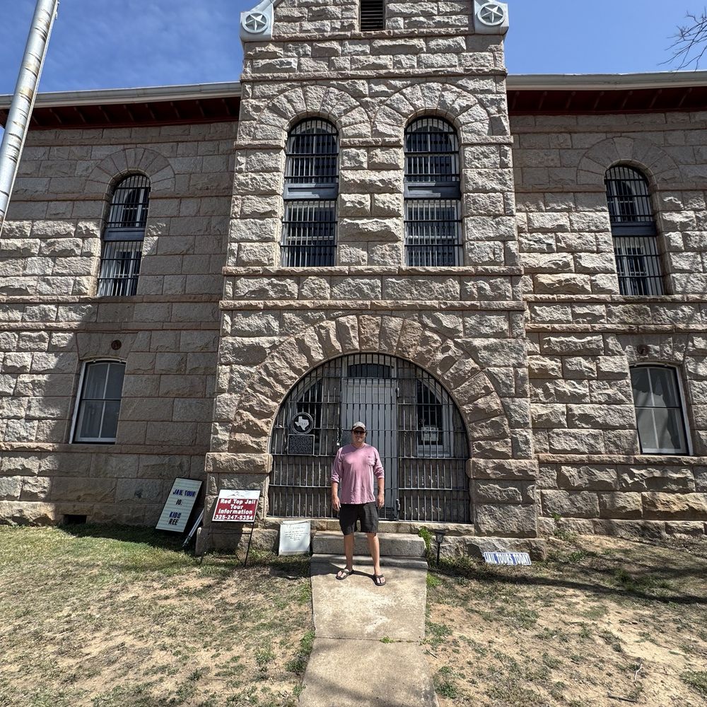 Llano Red Top Jail Tour - My husband out front of the jail - Historical Tours Near Me - Llano, Texas Llano Red Top Jail Tour - My husband out front of the jail - Historical Tours Near Me - Llano, Texas