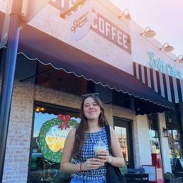 me holding my latte in front of the shop! me holding my latte in front of the shop!