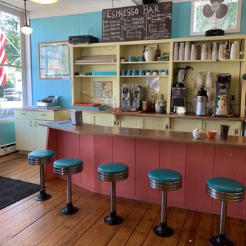 Tiffanys Cafe - a counter with stools and a chalkboard - Ice Cream & Frozen Yogurt Near Me - Empire, Michigan