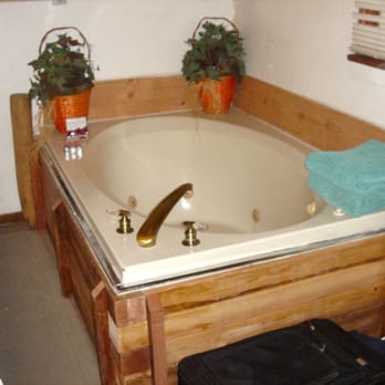 Cabins4less - The tub of cabin #16. I assumed it use to be a jacuzzi but it was sealed up at the time. - Rafting/Kayaking Near Me - Big Bear Lake, California