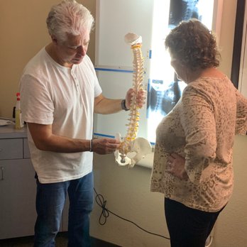 Procare Sports Chiropractic - Dr. Cook walking a patient through their customized chiropractic treatment plan - Chiropractors Near Me - Encinitas, California Procare Sports Chiropractic - Dr. Cook walking a patient through their customized chiropractic treatment plan - Chiropractors Near Me - Encinitas, California