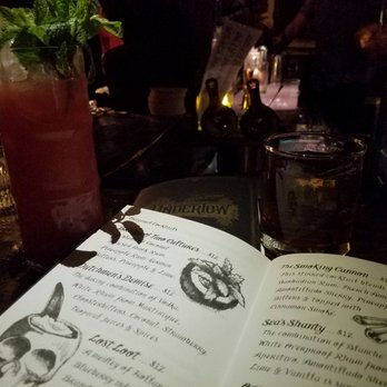 Undertow - Arcadia - The menu surrounded by our epic drinks - Tiki Bars Near Me - Phoenix, Arizona