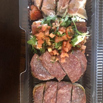 Postino Broadway - Bruschetta board: top to bottom proscuitto/fig/mascarpone, burrata/bacon/arugula/tomato, salami and pesto x 2 - Wine Bars Near Me - Denver, Colorado Postino Broadway - Bruschetta board: top to bottom proscuitto/fig/mascarpone, burrata/bacon/arugula/tomato, salami and pesto x 2 - Wine Bars Near Me - Denver, Colorado