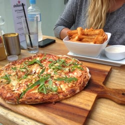 xxxx - Cajun chicken pizza with beer-battered chips and Cajun salt...