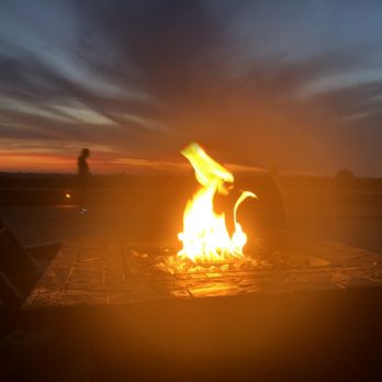 Bilmar Beach Resort - Fire pits and lounge chairs at night. - Resorts Near Me - Treasure Island, Florida