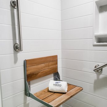 Rapid Bath & Construction - Onyx shiplap wall pattern in the color Breeze with teakwood foldable chair. - General Contractors Near Me - Vancouver, Washington