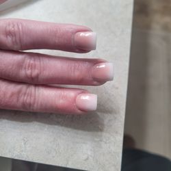 Luxe Nails & Spa - Bad attempt to ombre a French tip. Nails are not even, and several are pointed in different directions. My
