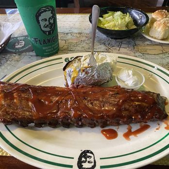 Flanigan’s - Caesar salad and the garlic rolls, a full rack of baby backs with a loaded baked potato. - Seafood Near Me - Sunrise, Florida Flanigan’s - Caesar salad and the garlic rolls, a full rack of baby backs with a loaded baked potato. - Seafood Near Me - Sunrise, Florida