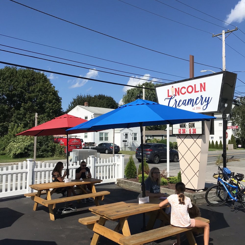 Lincoln Creamery - a woman sitting at a picnic table - Ice Cream & Frozen Yogurt Near Me - Lincoln, Rhode Island Lincoln Creamery - a woman sitting at a picnic table - Ice Cream & Frozen Yogurt Near Me - Lincoln, Rhode Island