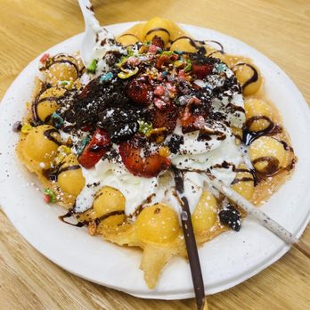 Kaua’i Partea - a plate of waffles topped with fruit and whipped cream - Coffee & Tea Near Me - Lihue, Hawaii