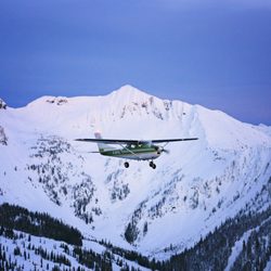 Kootenay Lake Aviation - Our Cessna 182 flying over Whitewater Ski Resort