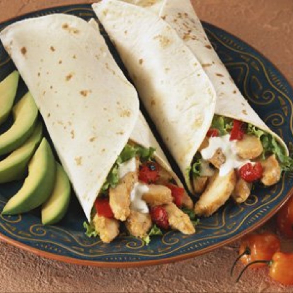 Avalon Restaurant - two chicken burritos on a plate with avocado and tomatoes - Breakfast & Brunch Near Me - Victoria, British Columbia Avalon Restaurant - two chicken burritos on a plate with avocado and tomatoes - Breakfast & Brunch Near Me - Victoria, British Columbia
