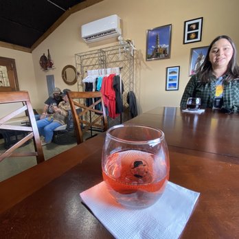 Little Old Wine Drinkers Winery - a woman sitting at a table - Wineries Near Me - Kingman, Arizona Little Old Wine Drinkers Winery - a woman sitting at a table - Wineries Near Me - Kingman, Arizona