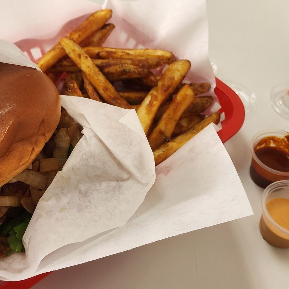 Single cheeseburger with grilled onions. Fries well done and assortment of their sauces Single cheeseburger with grilled onions. Fries well done and assortment of their sauces