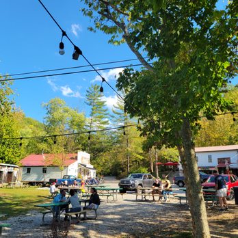 Rabbit Hash General Store - people sitting at picnic tables - Antiques Near Me - Rabbit Hash, Kentucky