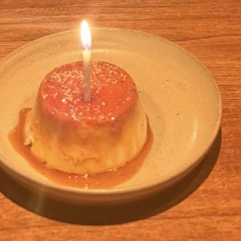 Acamaya - Flan with a birthday candle :) - Mexican Near Me - New Orleans, Louisiana Acamaya - Flan with a birthday candle :) - Mexican Near Me - New Orleans, Louisiana