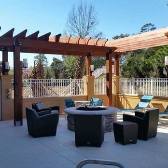 A Cut Above - a patio with chairs and a table - Landscaping Near Me - Jacksonville, Florida A Cut Above - a patio with chairs and a table - Landscaping Near Me - Jacksonville, Florida