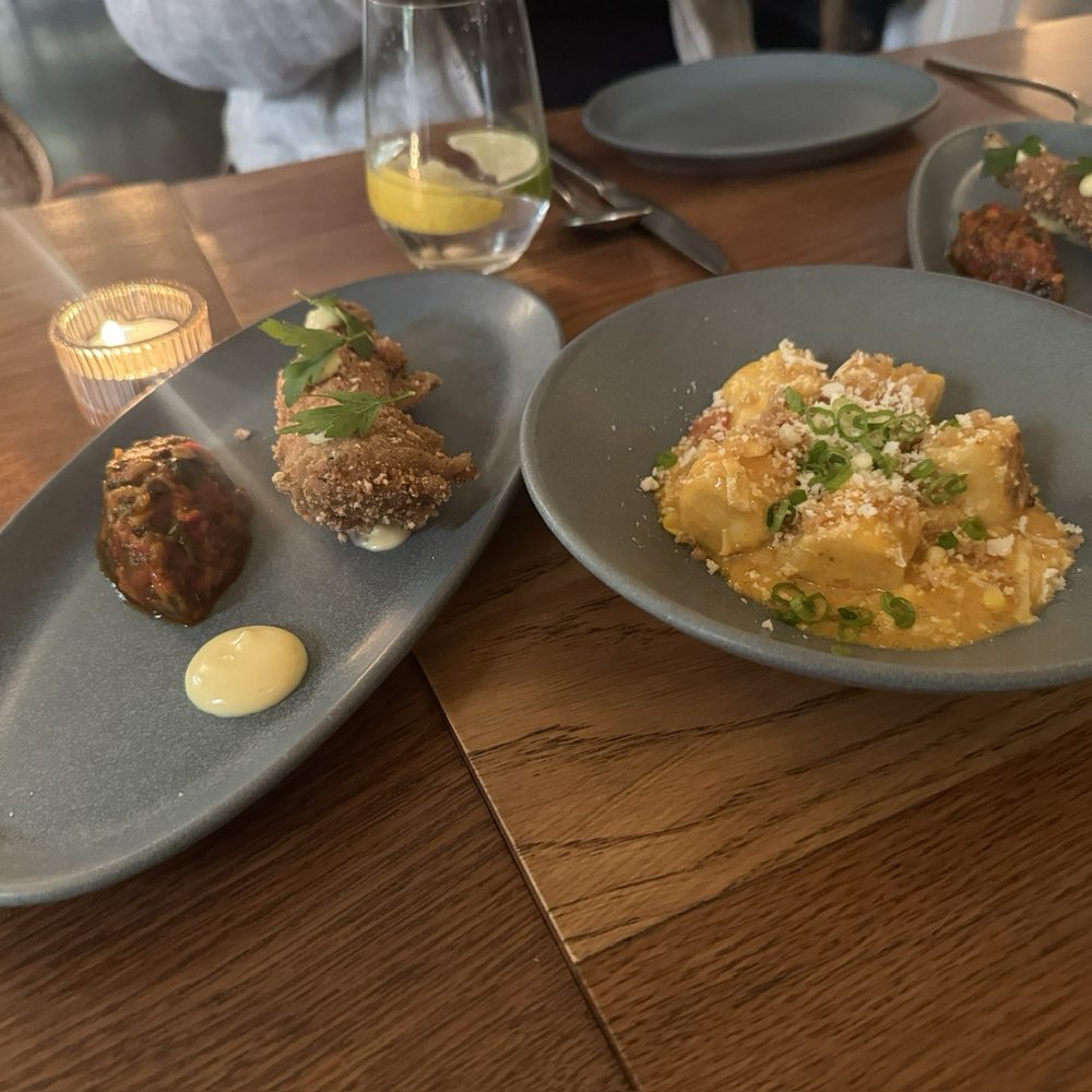 Common Thread Savannah - Pasta in a cream sauce on right. Fried eggplant on left. - New American Near Me - Savannah, Georgia Common Thread Savannah - Pasta in a cream sauce on right. Fried eggplant on left. - New American Near Me - Savannah, Georgia