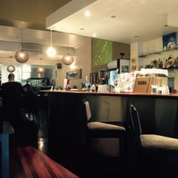 Grecian Scenes - The bar within the restaurant. Interesting but too many art decos that clash. Limited alcohol on display. Is this all they sell?