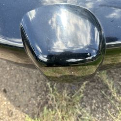 Elliott's Travel & Tours - Abrasions to the top side of my front bumper, from the underside of the bus bumper scraping over it.