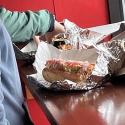 Salvatore's Hoagie Shop - A young give beginning to devour his Italian