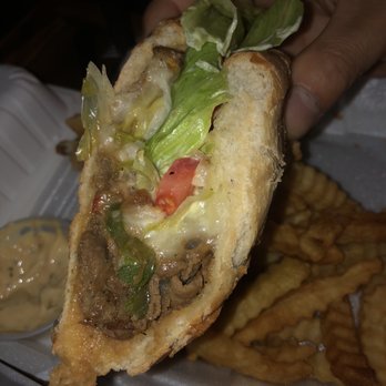 Ricky's Pub & Grill - Steak and Cheese Sandwich - Latin American Near Me - Arlington, Virginia Ricky's Pub & Grill - Steak and Cheese Sandwich - Latin American Near Me - Arlington, Virginia