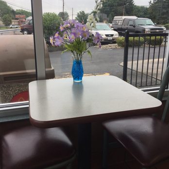 McDonald's - a blue vase of flowers on a table - Burgers Near Me - Schuylkill Haven, Pennsylvania