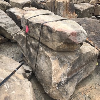 The Turf Tailors - a pile of large rocks - Landscaping Near Me The Turf Tailors - a pile of large rocks - Landscaping Near Me