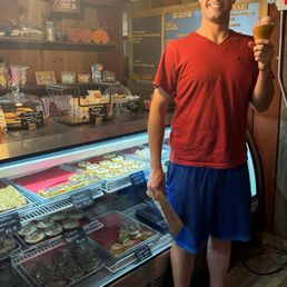 In front of the food case at the Red Barn Cremery In front of the food case at the Red Barn Cremery