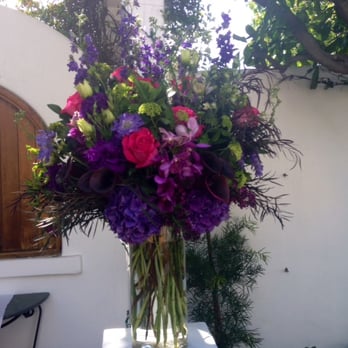 Be Buds Florist - two lush arrangements stood on pillars flanking the arch at Verandas Beach House - Florists Near Me - Torrance, California Be Buds Florist - two lush arrangements stood on pillars flanking the arch at Verandas Beach House - Florists Near Me - Torrance, California
