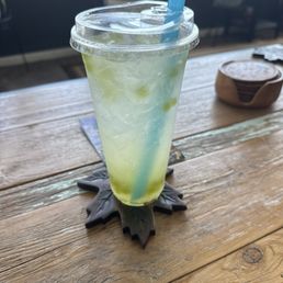 Lotus with peach pineapple coconut and green apple popping boba Lotus with peach pineapple coconut and green apple popping boba