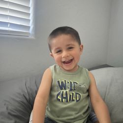 East to West Hair Artistry - 2 yr old Thomas happy with his cut from Victor!