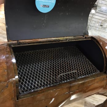 Homegoods - Inside of the $599.99 pig, considering its metal you could easily weld in a little higher grill shelf for corn or potatoes not to burn. - Home Decor Near Me - Novi, Michigan