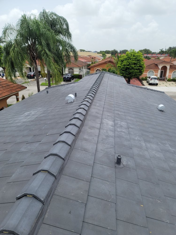 Slide of JMR Roofing Services