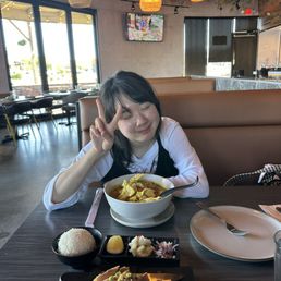 My wife enjoying Yellow Curry Noodle My wife enjoying Yellow Curry Noodle