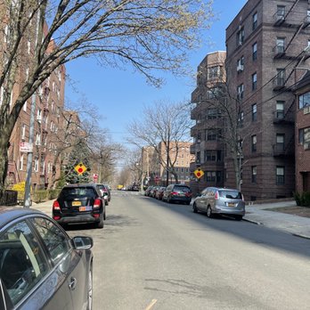 Rego Park - a street with cars parked on both sides of the street - Restaurants Near Me - Rego Park, New York Rego Park - a street with cars parked on both sides of the street - Restaurants Near Me - Rego Park, New York