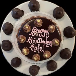 flourless chocolate cake surrounded by the famous mocha macaroons
