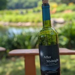 Worthington Vineyard & Winery - Red blend with a garden/pond view