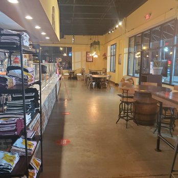 La Mixteca Tamale House - Inside of restaurant with shirts for sale on left side. - Mexican Near Me - Suwanee, Georgia