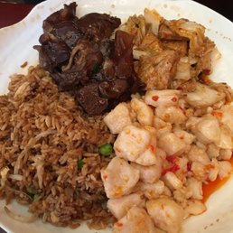 The insanely enormous 3 item $10 lunch platter! Today was fish, tofu, and stewed pig hock. The insanely enormous 3 item $10 lunch platter! Today was fish, tofu, and stewed pig hock.