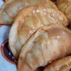 Sweet Pumpkin Pie Empanada drizzled with caramel sauce