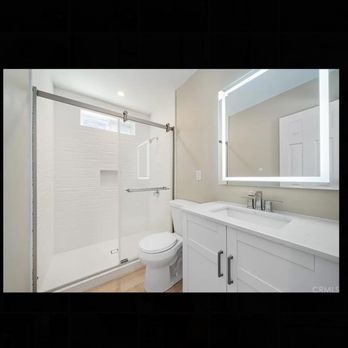 Central Coast Renovations - a bathroom with a shower, toilet, and sink - General Contractors Near Me - Atascadero, California Central Coast Renovations - a bathroom with a shower, toilet, and sink - General Contractors Near Me - Atascadero, California