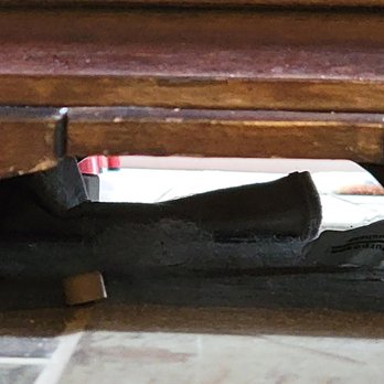 Pristine Properties Vacation Rentals - Under the entertainment center as you walk up the steps. Is that a dust animal and dirt? - Vacation Rental Agents Near Me - Port St Joe, Florida