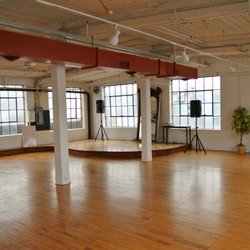 The large industrial windows drench the stage with beautiful natural lighting.