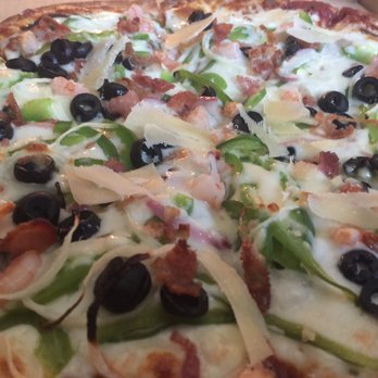 Sam's Pizza and Donair - a closeup of a pizza - Pizza Near Me - Edmonton, Alberta Sam's Pizza and Donair - a closeup of a pizza - Pizza Near Me - Edmonton, Alberta